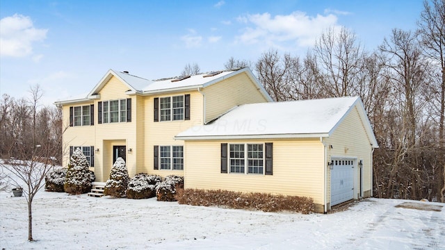 view of front of property with a garage