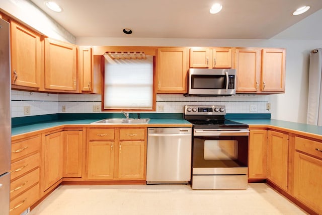 kitchen featuring decorative backsplash, sink, stainless steel appliances, and light brown cabinetry