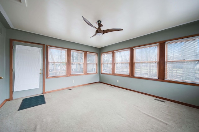 interior space featuring ceiling fan and carpet floors