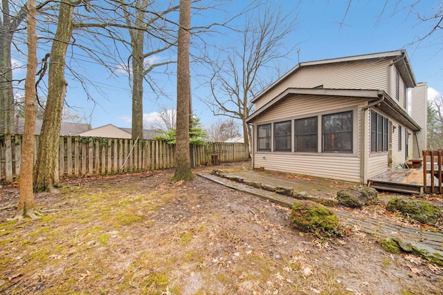 view of side of property with a deck