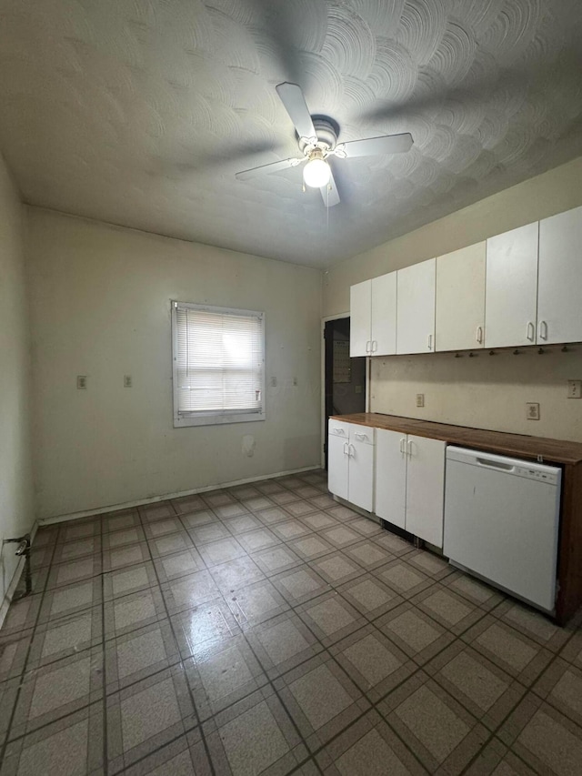 kitchen featuring white dishwasher, ceiling fan, and white cabinets