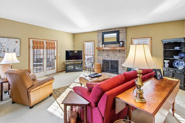 living room with a brick fireplace, light colored carpet, and a wealth of natural light