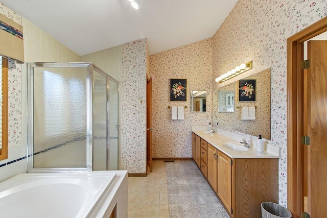 bathroom with separate shower and tub, vanity, and tile patterned floors