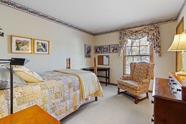 bedroom featuring light carpet