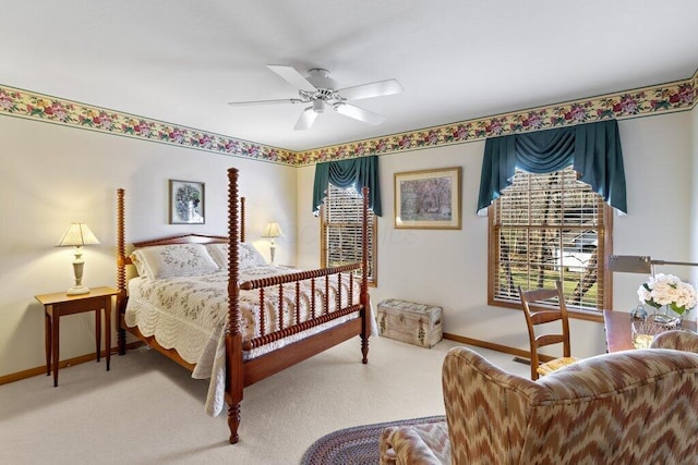 bedroom featuring ceiling fan and carpet