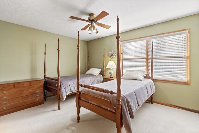 bedroom featuring ceiling fan and light colored carpet