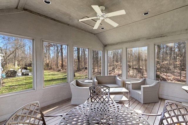 sunroom / solarium featuring ceiling fan and lofted ceiling