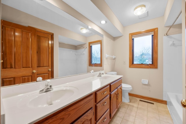 full bathroom with tile patterned flooring, vanity, toilet, and a wealth of natural light