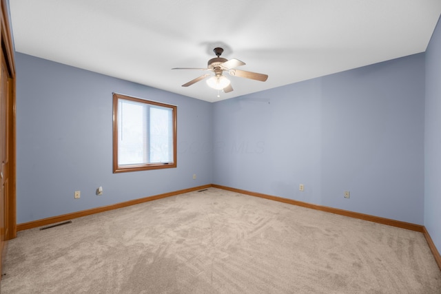 carpeted empty room with ceiling fan