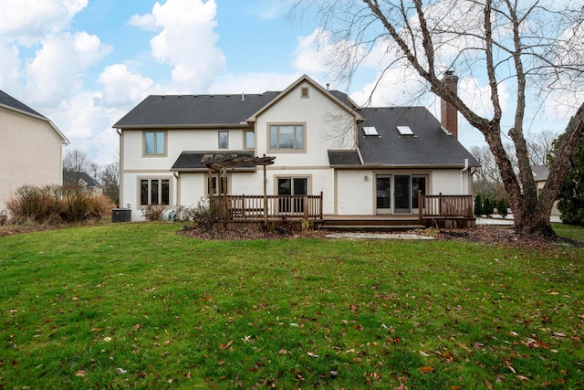 back of house with a pergola, a yard, a wooden deck, and central air condition unit