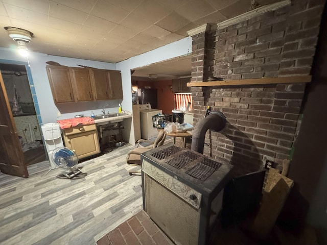 kitchen featuring washer / clothes dryer and light wood-type flooring