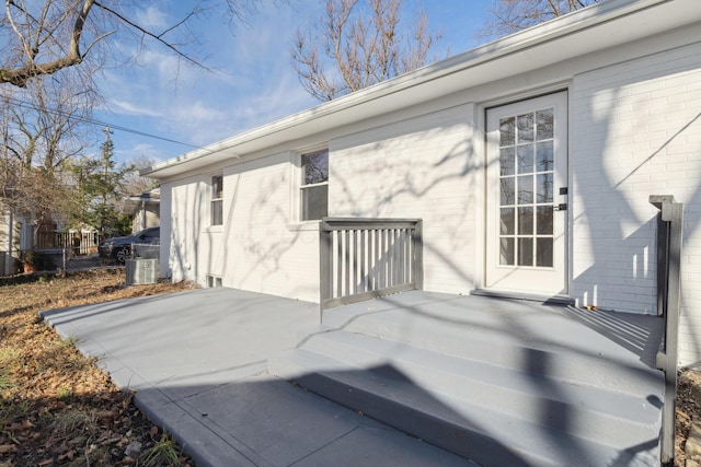 wooden terrace featuring central AC and a patio