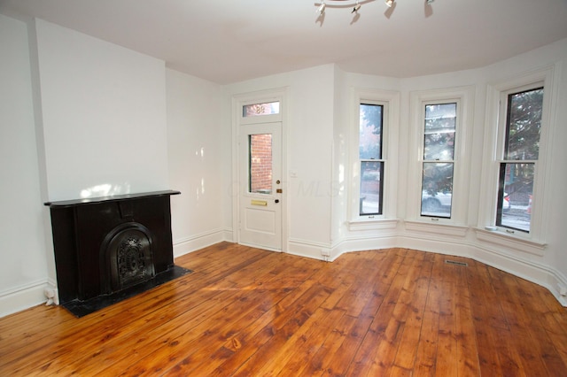 entrance foyer with hardwood / wood-style floors