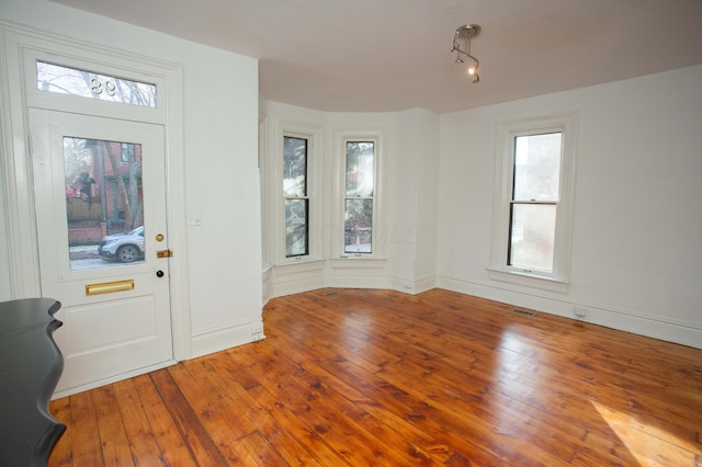 entrance foyer with hardwood / wood-style floors