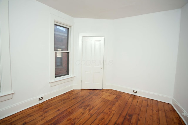 empty room with wood-type flooring