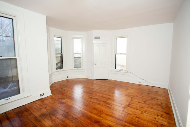 unfurnished room featuring wood-type flooring