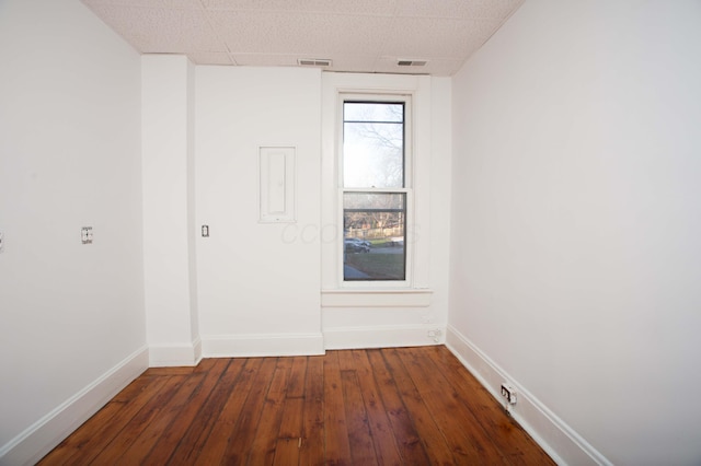 unfurnished room with dark hardwood / wood-style floors