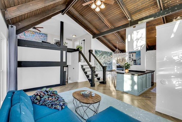 living room with high vaulted ceiling, wood ceiling, ceiling fan, beam ceiling, and light hardwood / wood-style flooring