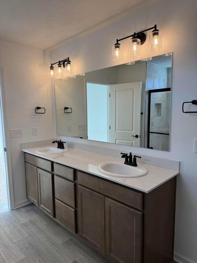 bathroom with vanity and walk in shower