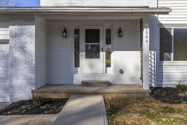 entrance to property featuring covered porch