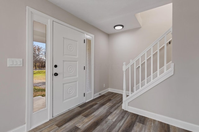 entryway with dark hardwood / wood-style floors