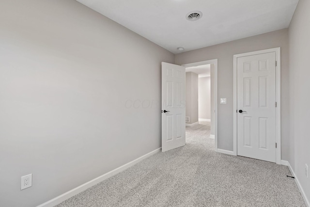 unfurnished bedroom with light carpet