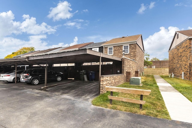 view of vehicle parking featuring a carport