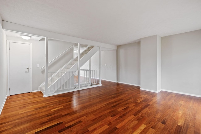 unfurnished living room with hardwood / wood-style floors