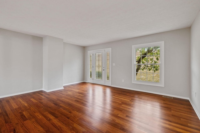 empty room featuring wood-type flooring