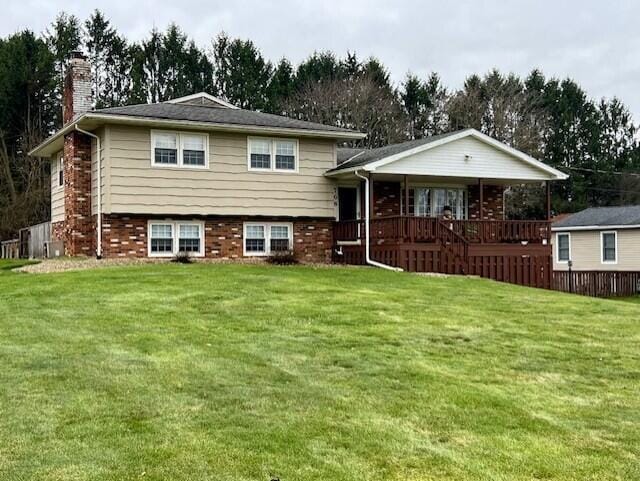 split level home with a porch and a front yard