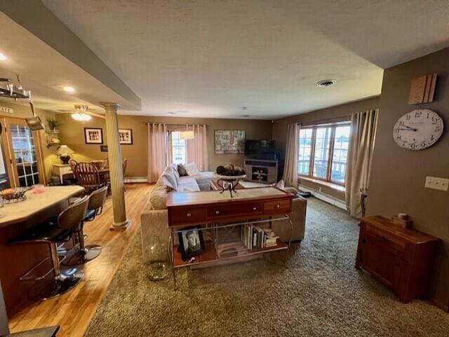 living room featuring plenty of natural light and wood-type flooring