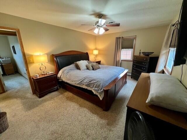 bedroom featuring ceiling fan, carpet floors, and a baseboard radiator