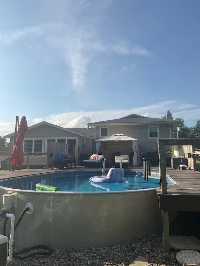 view of swimming pool featuring a deck