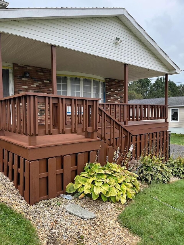 wooden terrace with a porch