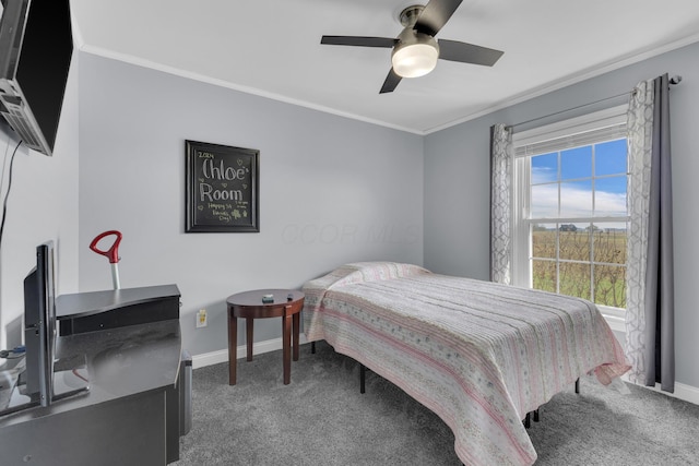 carpeted bedroom with baseboards, ceiling fan, and crown molding