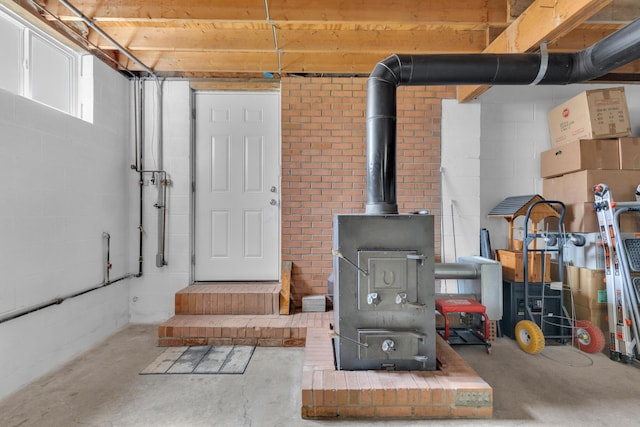 basement featuring a wood stove