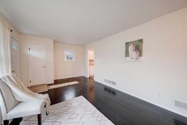 interior space with dark hardwood / wood-style flooring