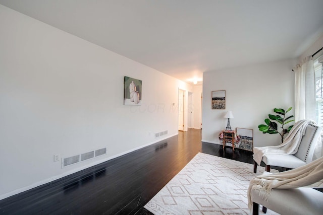 living area with dark wood-type flooring