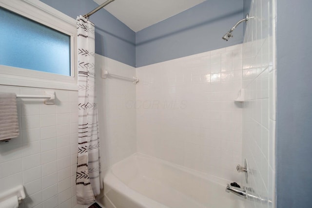 bathroom with shower / tub combo