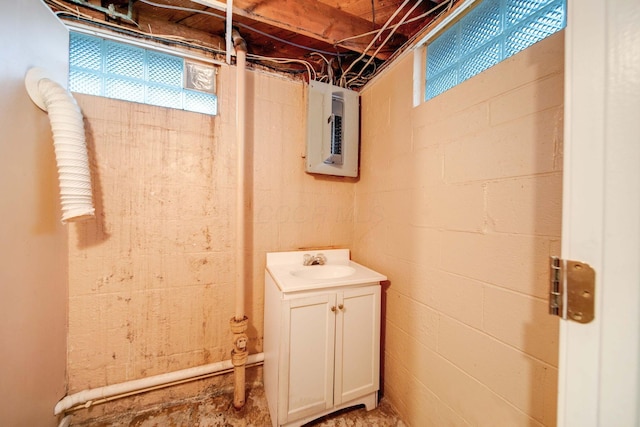 basement with electric panel and sink