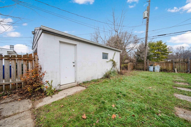 view of outbuilding featuring a yard