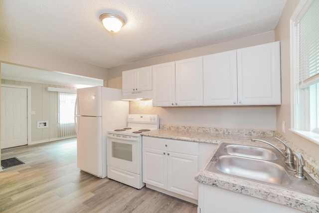 kitchen featuring a textured ceiling, sink, white cabinets, and white appliances