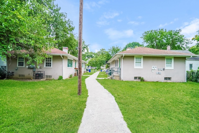 view of side of home featuring a yard