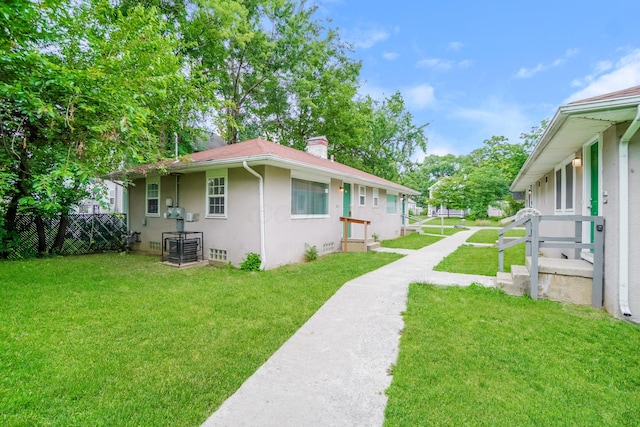 view of home's exterior with a lawn