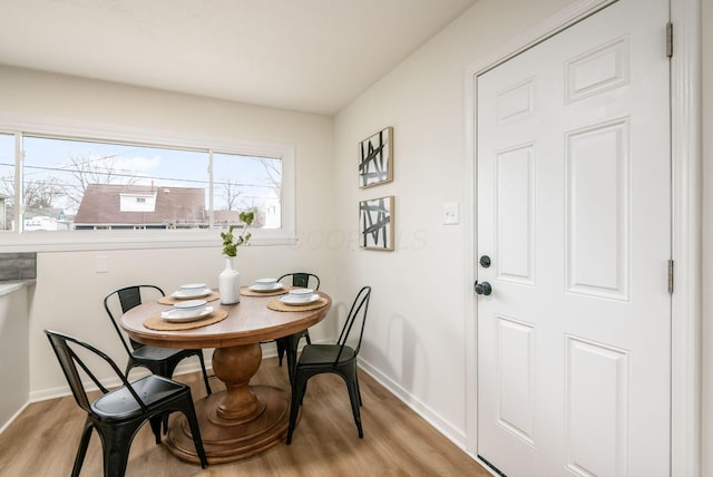 dining space featuring light hardwood / wood-style floors