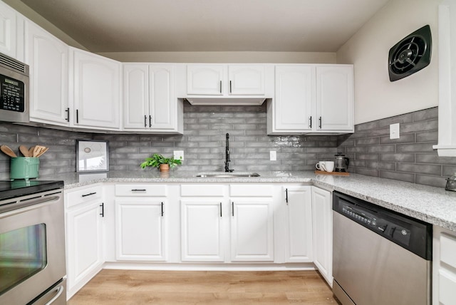 kitchen with white cabinetry, sink, and appliances with stainless steel finishes