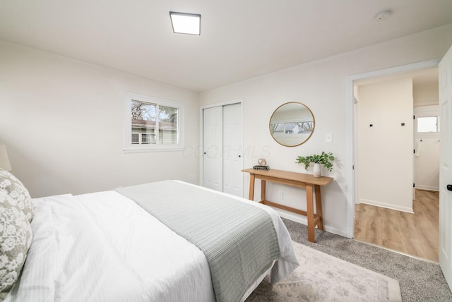 carpeted bedroom featuring a closet