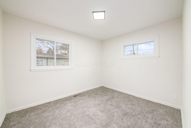 unfurnished room featuring carpet floors