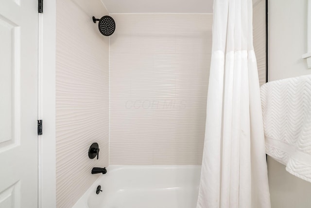 bathroom with shower / bathtub combination with curtain