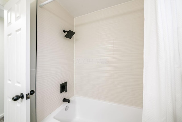 bathroom featuring shower / bathtub combination with curtain